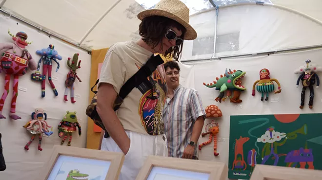 A person browses art