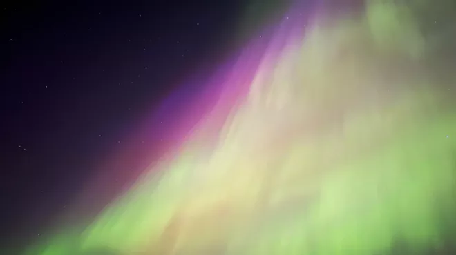 A green and purple sky