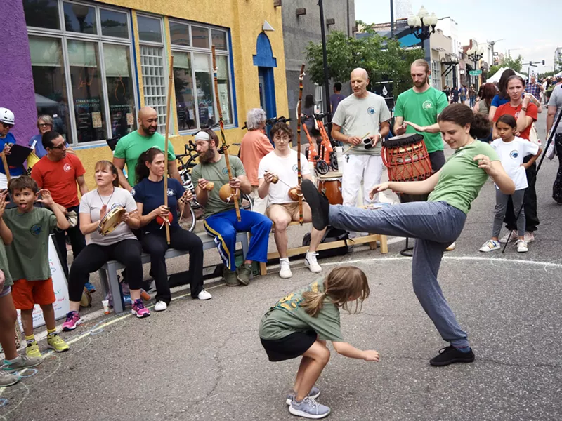 Image: street dancers dance in a drum circle