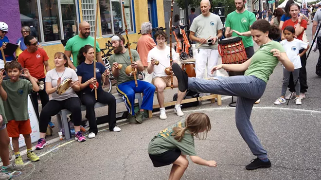 street dancers dance in a drum circle
