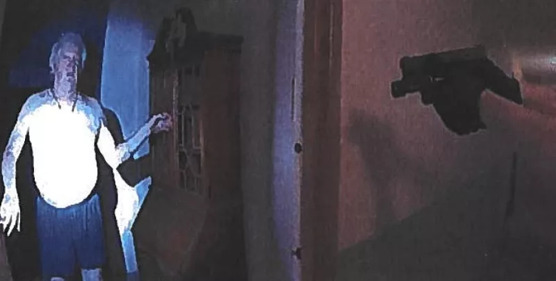 Image: A screen capture shared in the Nicholas Hanning arrest affidavit shows the officer pointing a taser at an obviously unarmed Michael Clark.