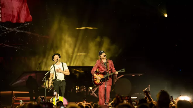 The Lumineers on stage at Empower Field