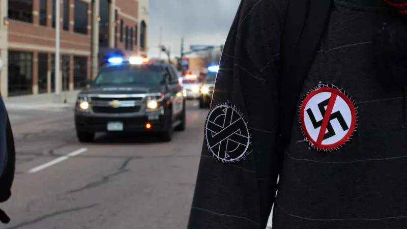 Image: A photo of the March protest as shared on the Colorado Springs Socialists Facebook page.