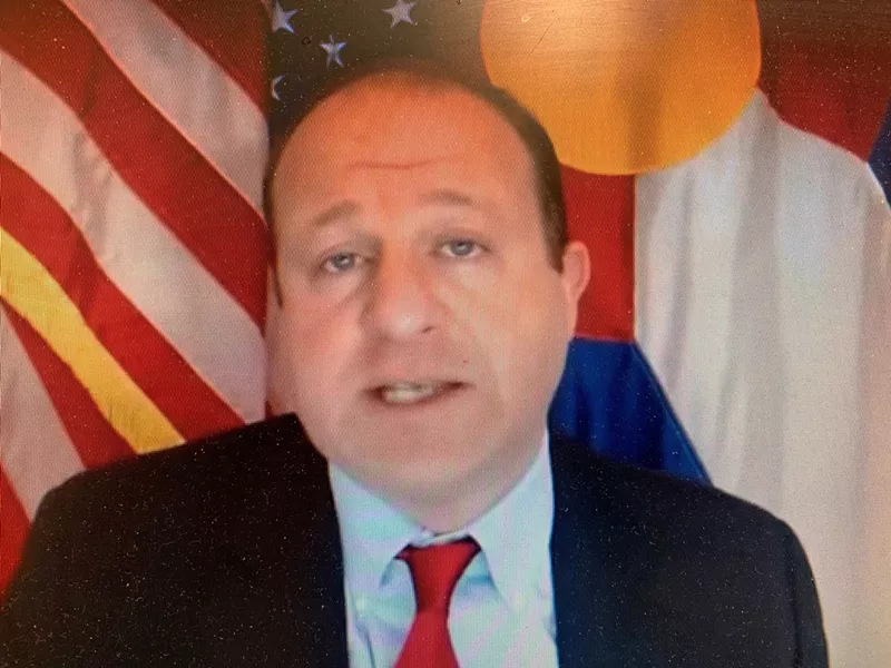 Image: Jared Polis's December 30 press conference focused on the virus variant.