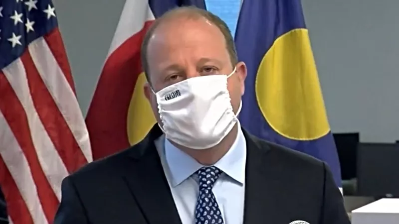 Image: Governor Jared Polis during an August 17 press conference about mail-in voting.