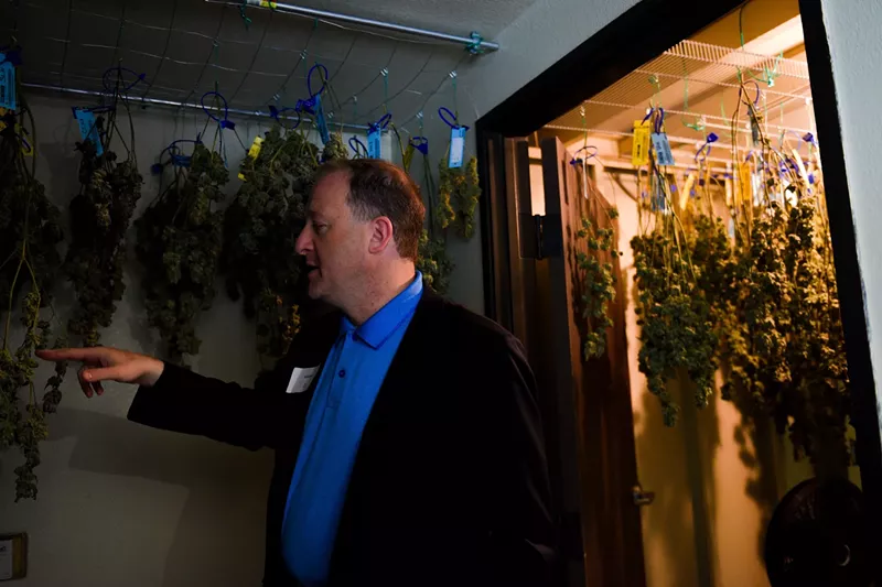 Image: Colorado Governor Jared Polis tours a marijuana growing facility in 2018 while on the campaign trail.