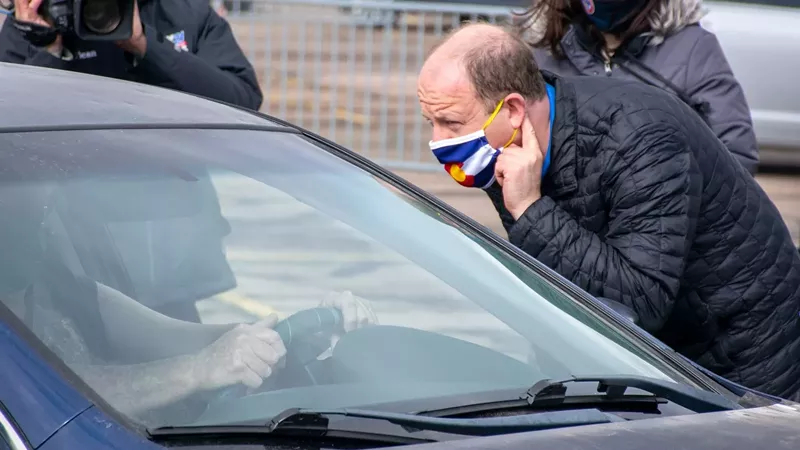 Image: Governor Jared Polis during a March 17 visit to the vaccination site at the Broadmoor World Arena in Colorado Springs.