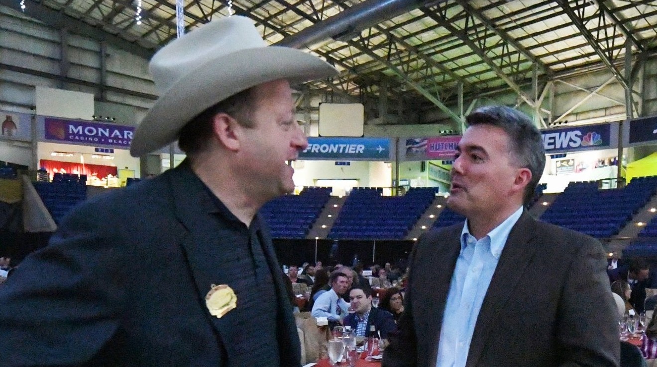 Governor Jared Polis donned a cowboy hat for this January 2019 photo with now-former senator Cory Gardner at the National Western Stock Show.