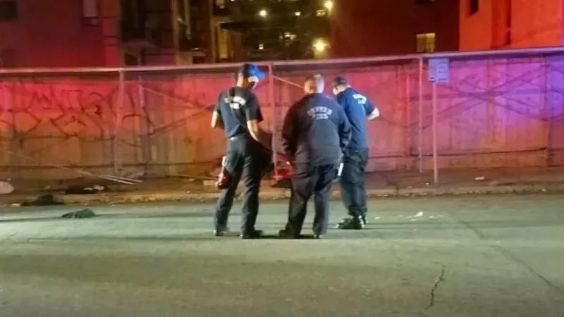 Image: Law enforcers near the scene near Tenth and Broadway on October 18, shortly after the crash.