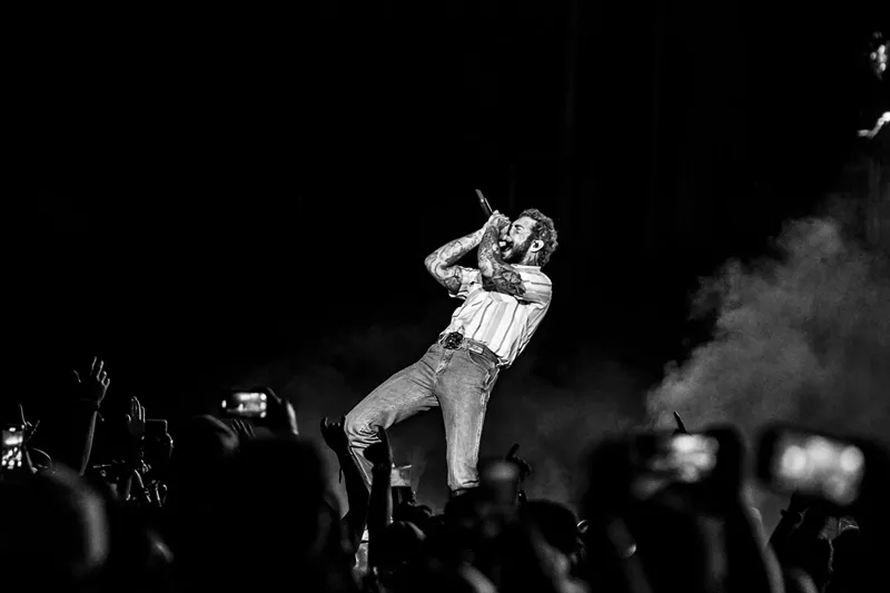 Image: Post Malone on stage at Empower Field at Mile High for The Big ASS Stadium Tour.