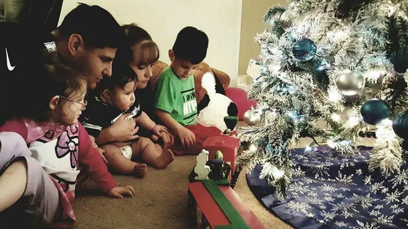 Image: Travis and Samantha Mason with their kids this past Christmas.