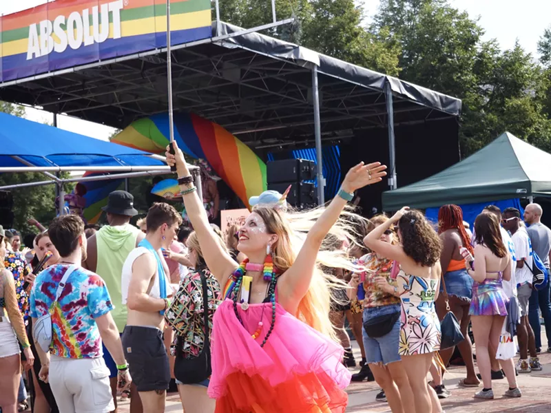 Image: A person in a pink dress dances