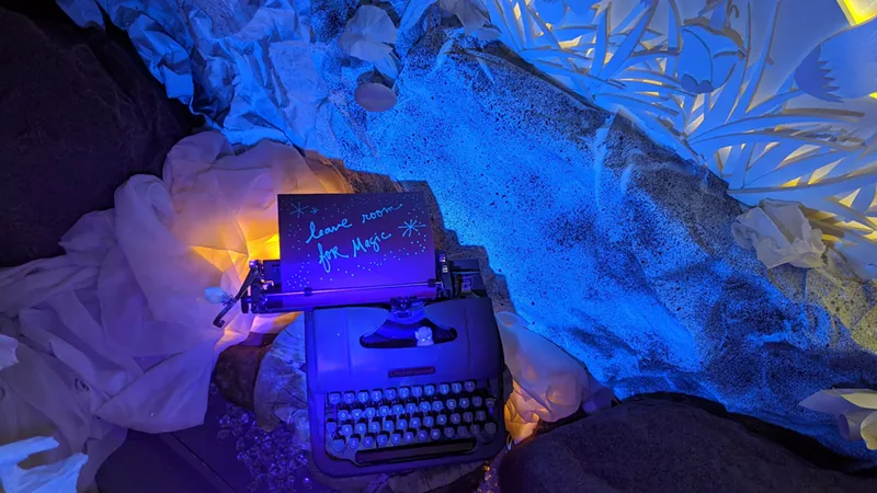 Image: A scene from inside Shiki Dreams that is illuminated with a black light flashlight.