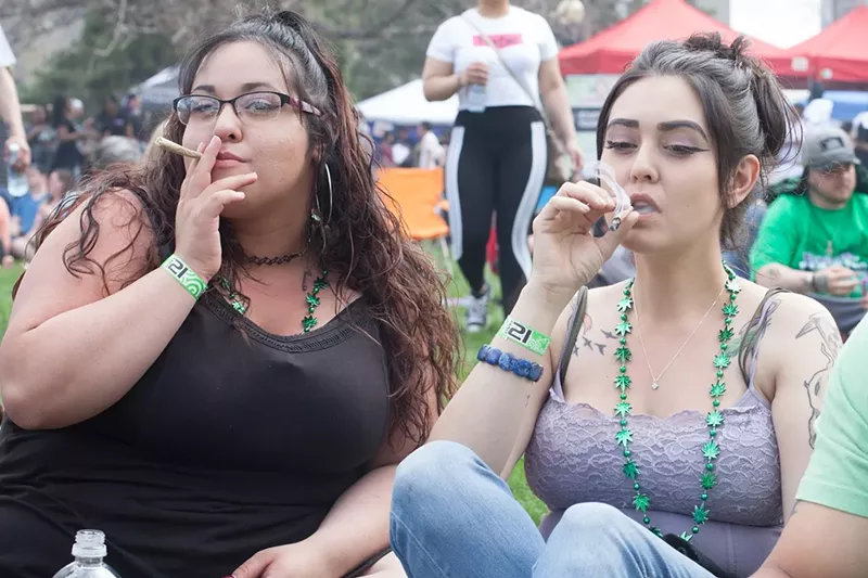 Image: Attendees of 2019's Fly Hi 420 Festival enjoy joints at Civic Center Park.