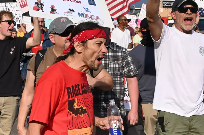 Image: A protester yells.