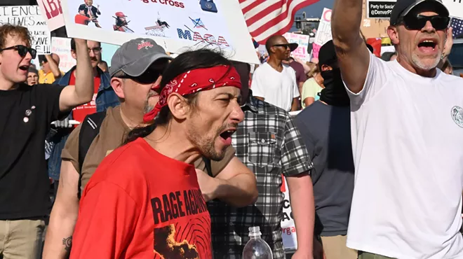 A protester yells.