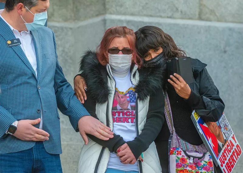 Image: Oslaida Mederos (middle), the mother of Rogel Aguilera-Mederos, spoke at a December 22 rally for her son in front of the Colorado Capitol.
