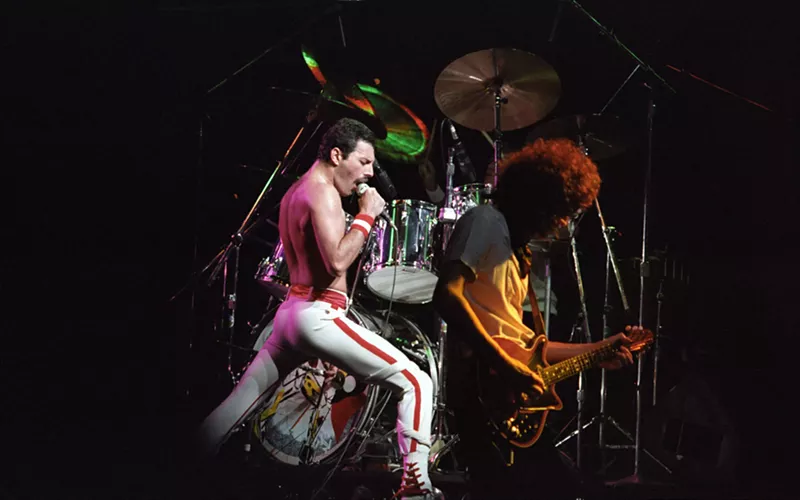 Image: A young Freddie Mercury performing with Queen.