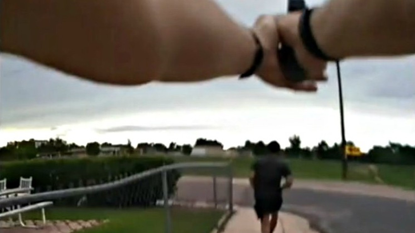 A screen capture of body-camera video showing a Colorado Springs Police Department sergeant shooting at De'Von Bailey.