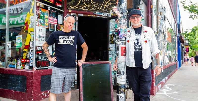 The owners of Mutiny Information Cafe, which is moving down Broadway.