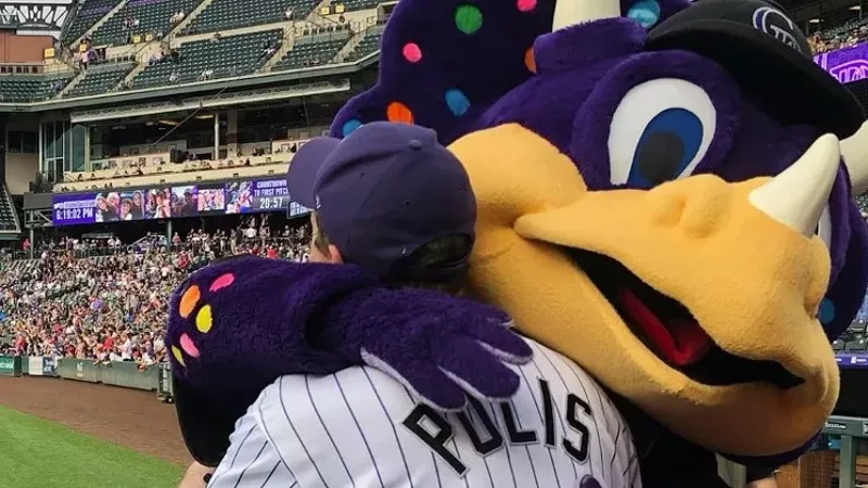Image: Dinger apparently loves Governor Jared Polis. But does Colorado love Dinger?