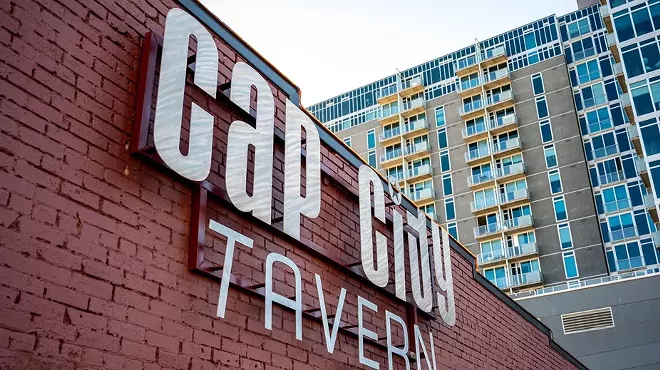 outside brick wall of tavern