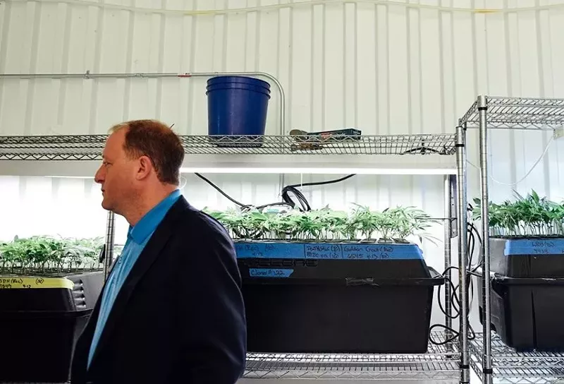 Image: Jared Polis, a strong proponent of marijuana while in the U.S. Congress, visits a Colorado grow in 2018.