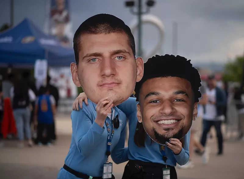 Image: nuggets fans with jokic and murray masks