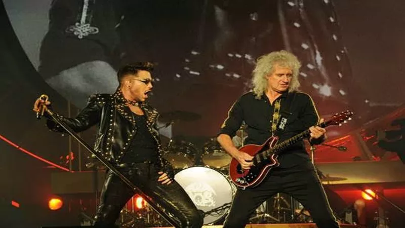 Image: Lambert performing with Queen.