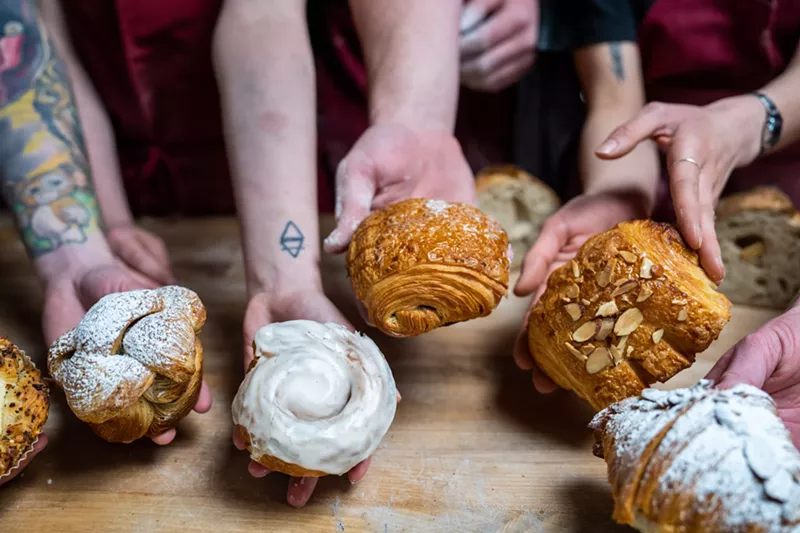 Image: hands holding baked goods
