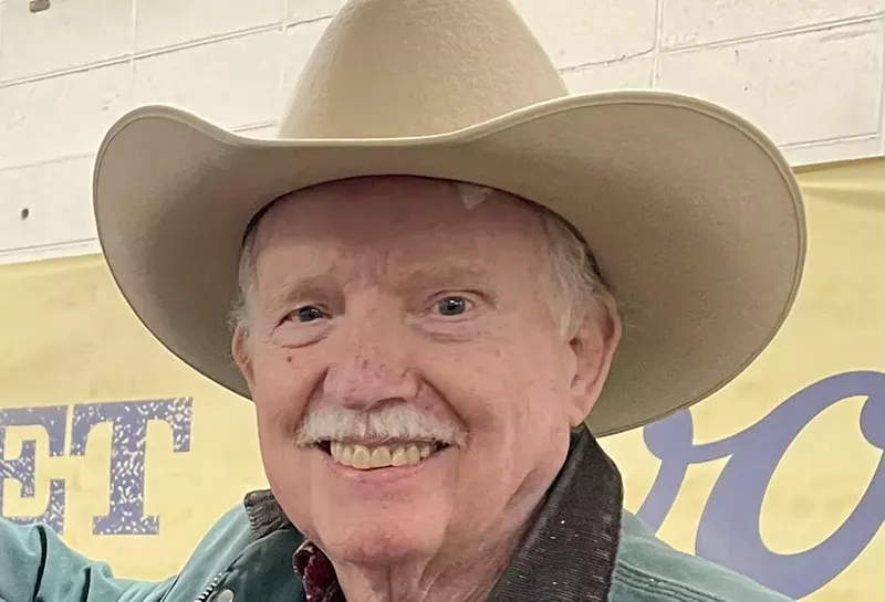 Image: man in cowboy hat.