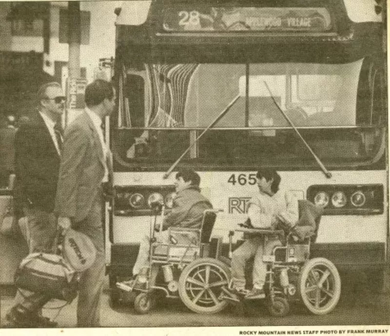 Image: ADAPT members block a bus with their wheelchairs to protest RTD buses on February 15, 1985.