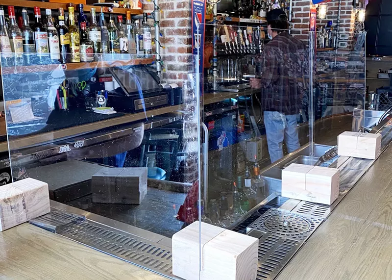Image: Occidental added plexiglass barriers atop its bar.