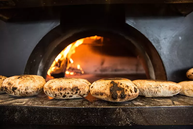 Image: Pita bread fresh from the oven at Safta.