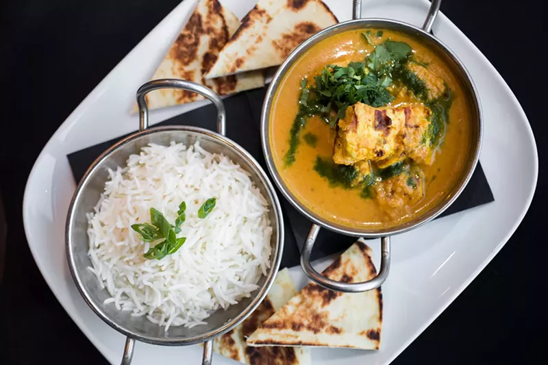 Image: Kuku paka is a family recipe and fan favorite at Ambli.