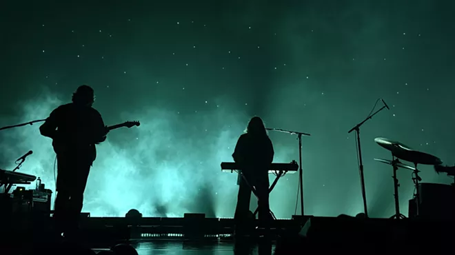 Beach House performing in Denver