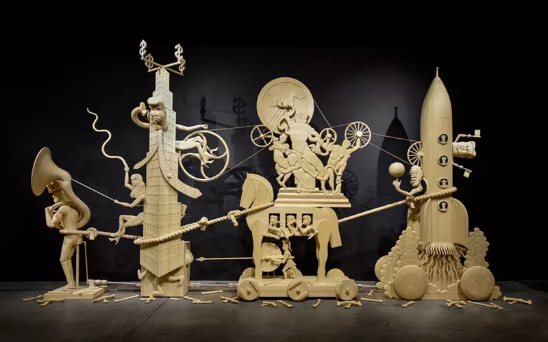 Image: “The March of Folly,” by John Buck, mixed materials and electric motor.