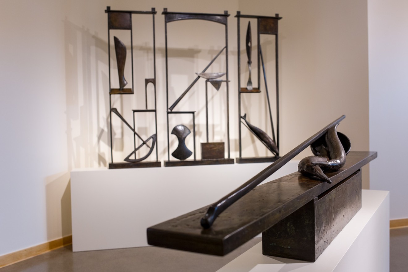 Neil Goodman’s “Still Life with Fish” (foreground) and “Triptych” (background), bronze.