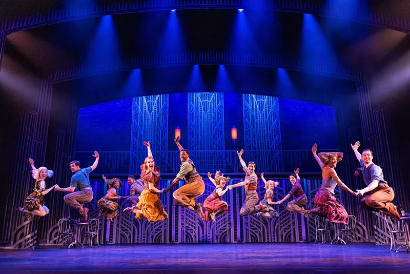Image: A musical theater ensemble performs a musical number.