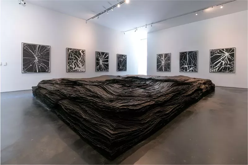 Image: Tara Donovan’s “Transplanted,” surrounded by shattered glass prints.