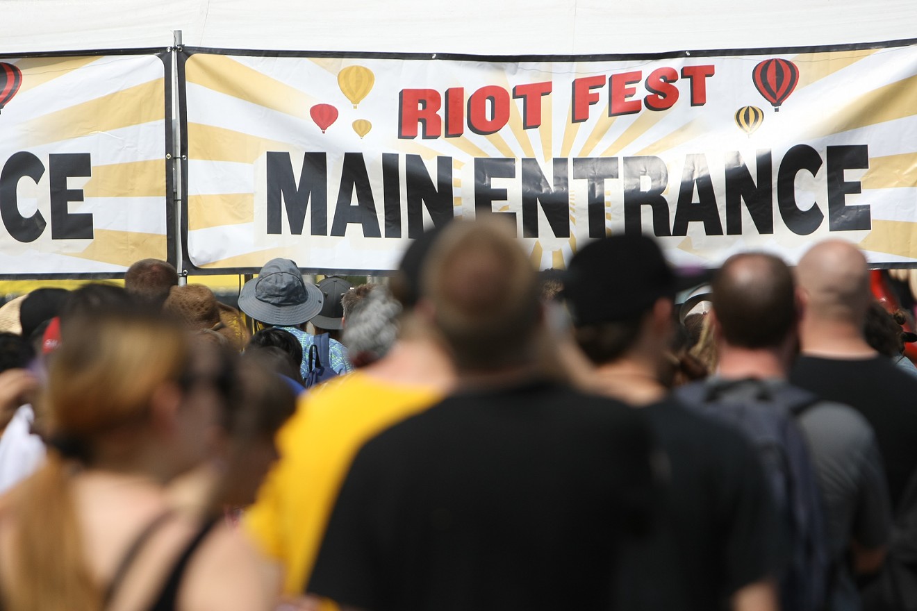 Fans wait for doors to open before the start of the 2015 Riot Fest Music Festival on August 28.