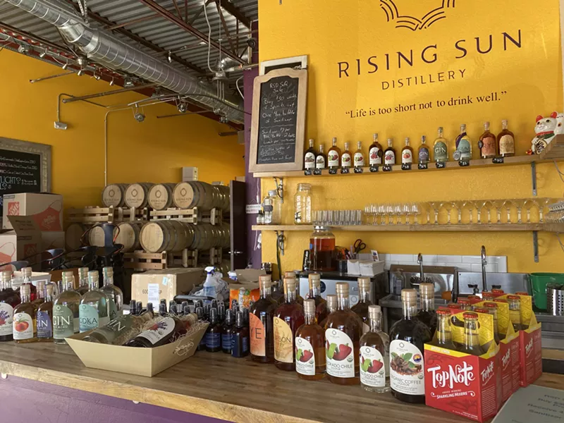 Image: Cocktail kits await pick-up while spirits age in barrels at Rising Sun Distillery.