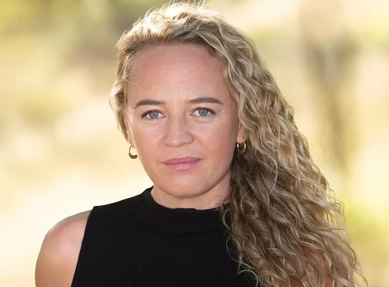 Image: A portrait of a woman with blond hair