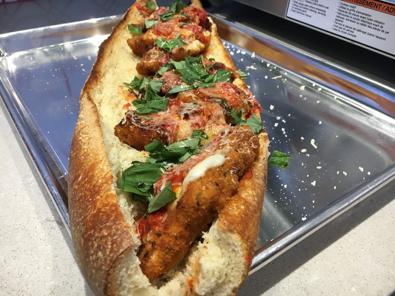 A chicken Parmesan sub with breading made from bagel crumbs.