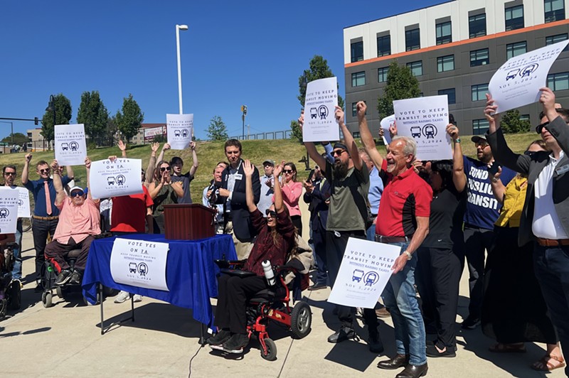 Advocates for Ballot Issue 7A gather outside of a Denver light rail station on September 6 to ask for voter support.