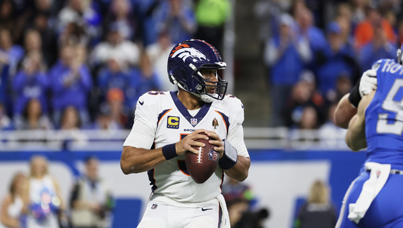 Image: Denver Broncos quarterback Russell Wilson dropping back for a pass against the Detroit Lions.