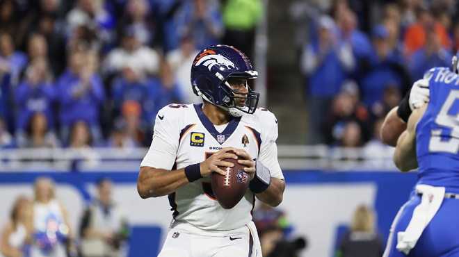 Denver Broncos quarterback Russell Wilson dropping back for a pass against the Detroit Lions.