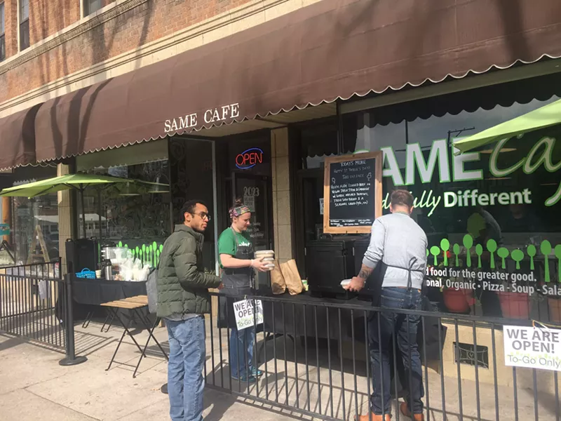 Image: Outside SAME Cafe on East Colfax Avenue, staff and volunteers are providing lunches, coffee and tea.