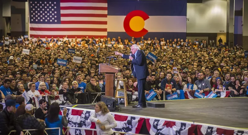 Image: Bernie Sanders speaks to a crowd of more than 11,000 on the floor of the Colorado Convention Center.