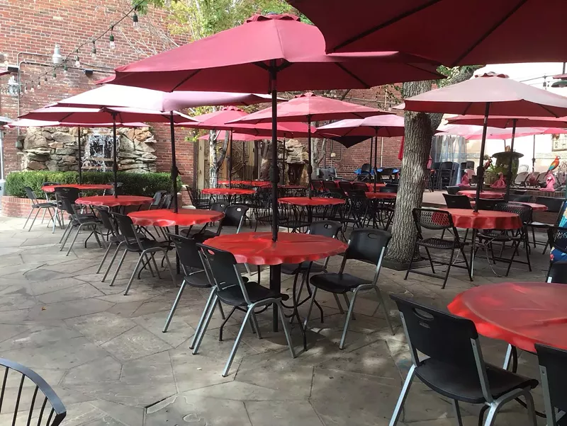 Image: patio with red umbrellas